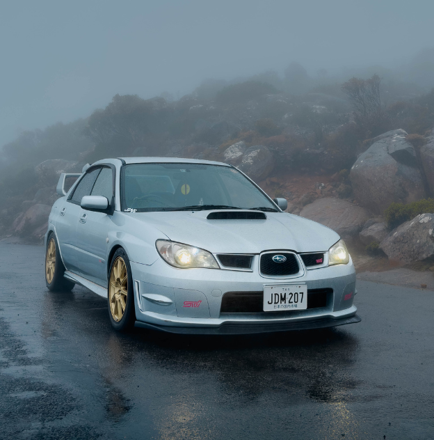 Silver WRX Subaru displaying JDM Black on White plates  with JDM 207 plate content